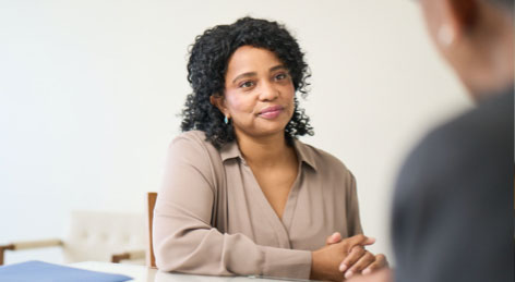 It's important to talk to your doctor about your overall health Woman talking about LYBALVI® (olanzapine and samidorphan) with a doctor