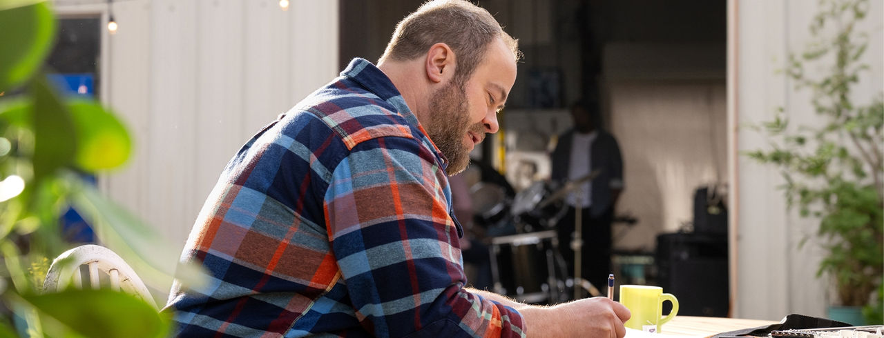 Man sitting and writing