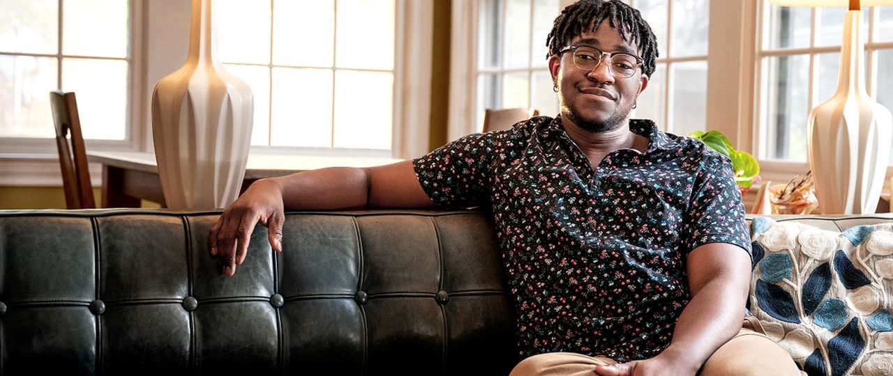 Man sitting indoors on a couch