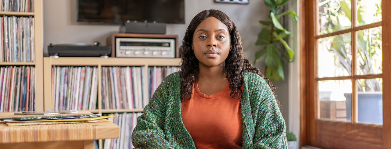 Woman with record player behind her